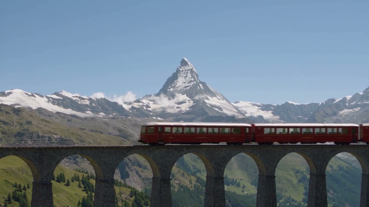 Swiss mountain train crossing a viaduct near the Matterhorn